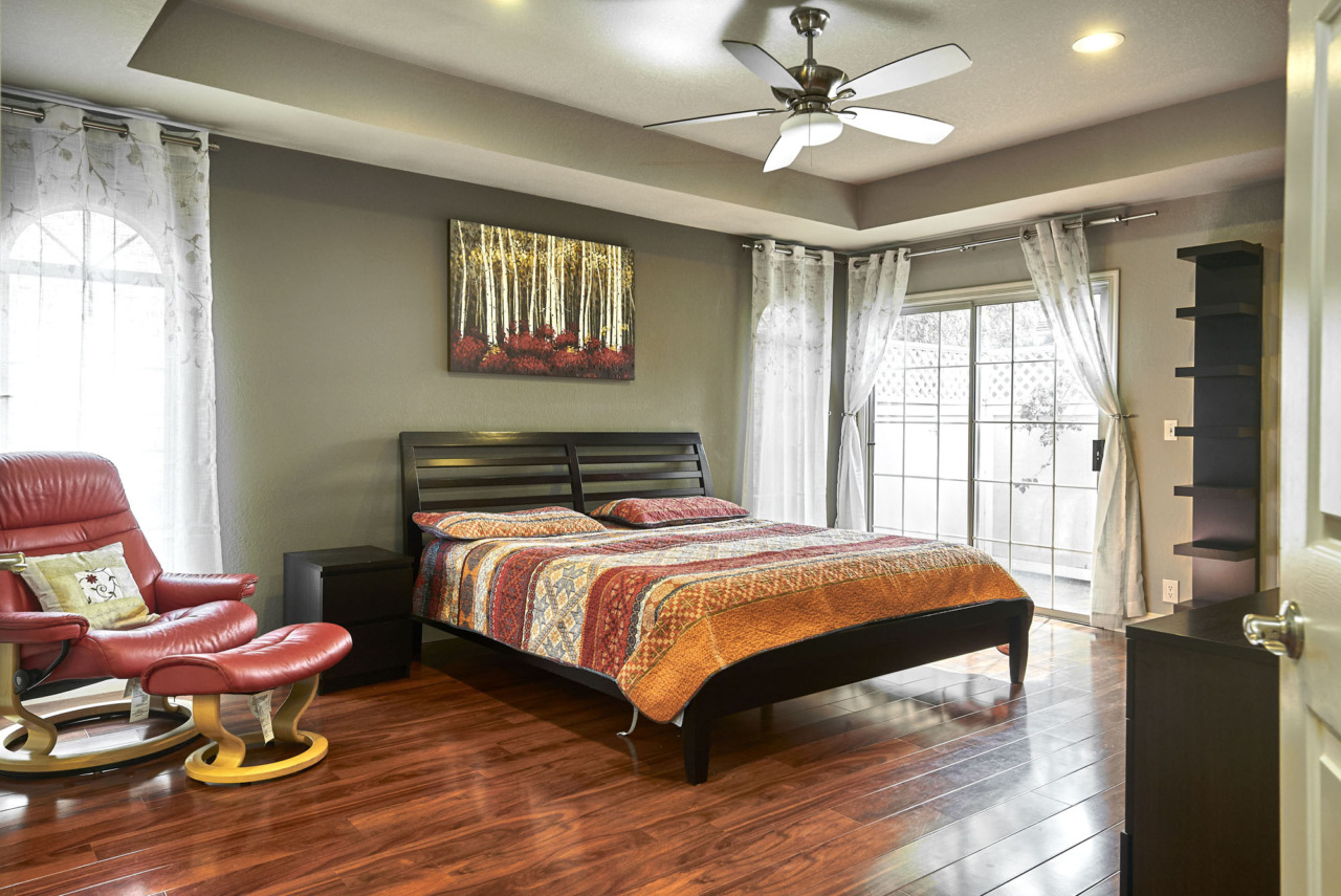 1180 Mountain Quail Circle - Full View of Large Bedroom with Large Window and Sliding Glass Door to Patio