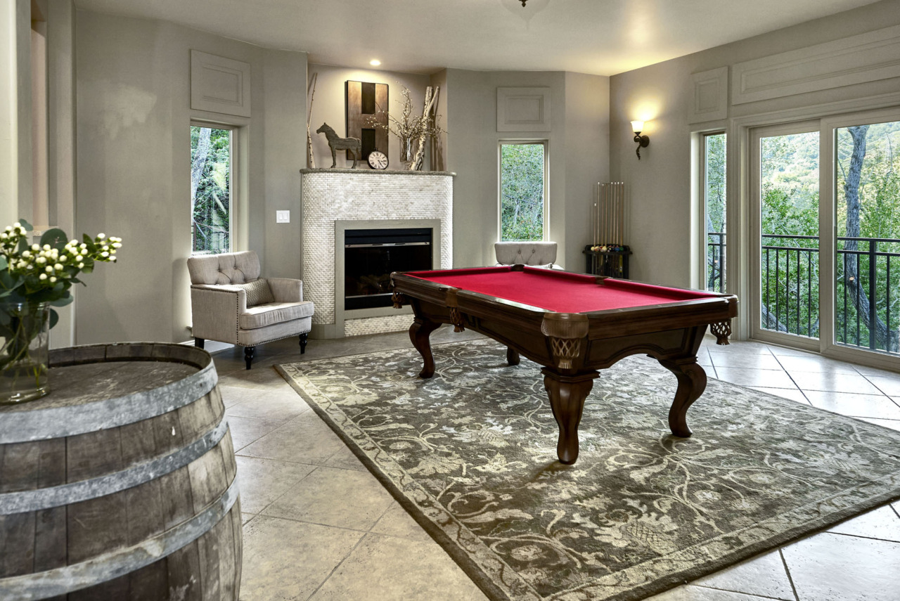 21290 Cinnabar Hills Road, pool table room with fireplace and view