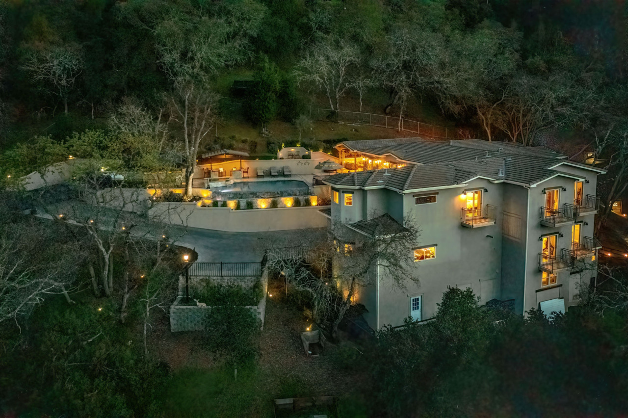 21290 Cinnabar Hills Road, aerial view of side of home in evening