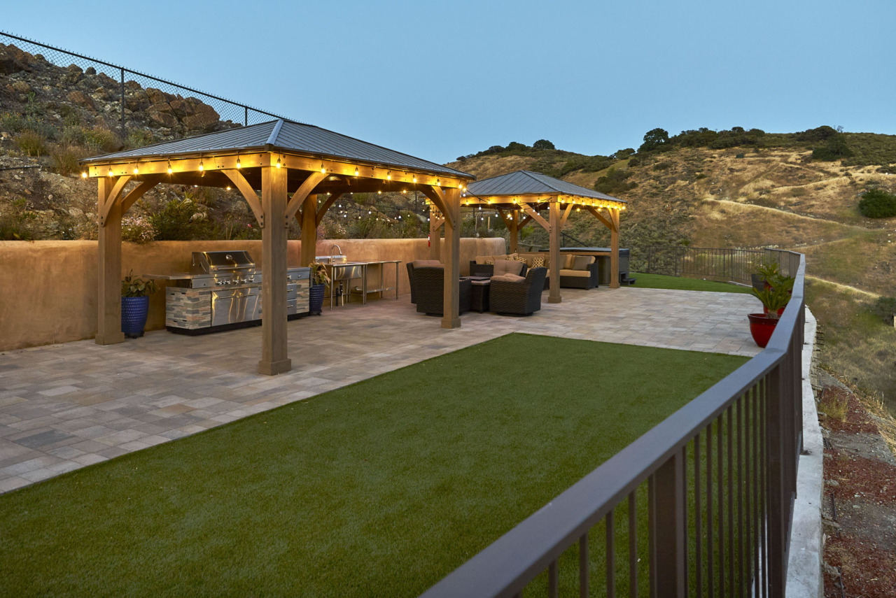 20601 Via Santa Teresa, upper level patio covered barbecue and outdoor seating area, evening