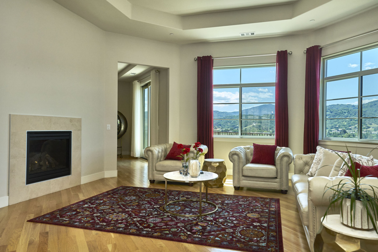 20601 Via Santa Teresa, angled view of living room with fireplace and view of mountains